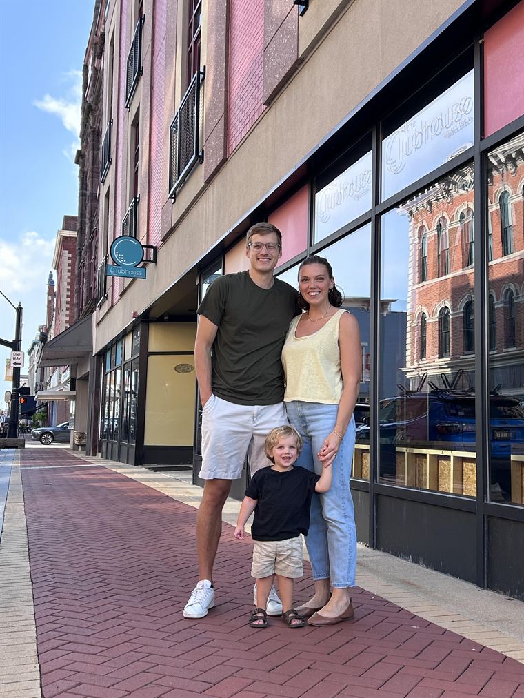 Carter and Stella Anderson with their son outside the Tiny Trades building in Muncie